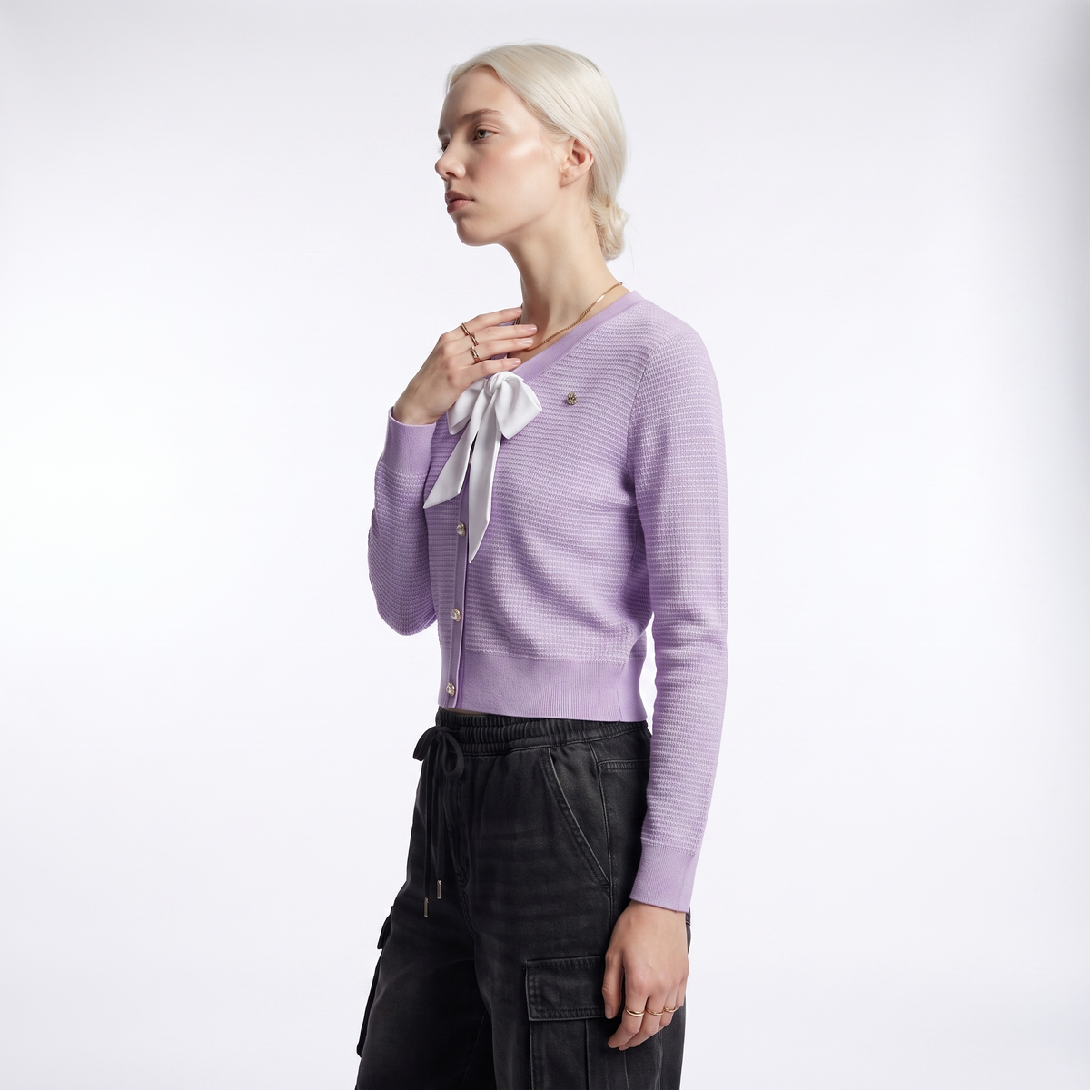 Lilac waffle knit cardigan, side view showing the fitted sleeve