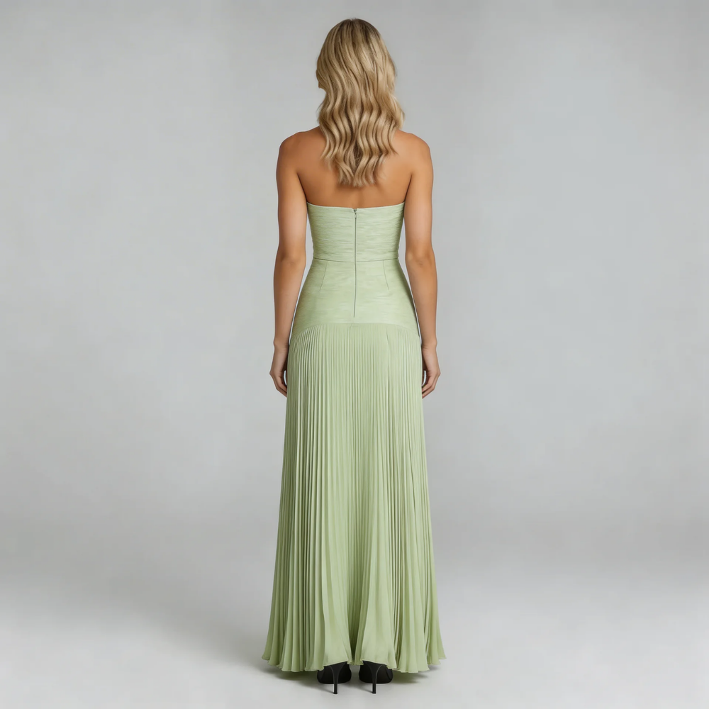 Sage green pleated maxi dress, back view showing the zip closure and pleated skirt